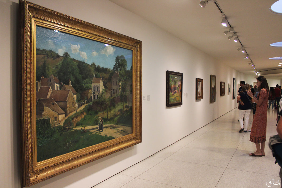 Painting "L'Hermitage a Pontoise" by Camille Pissarro exhibited at the Guggenheim Museum in New York