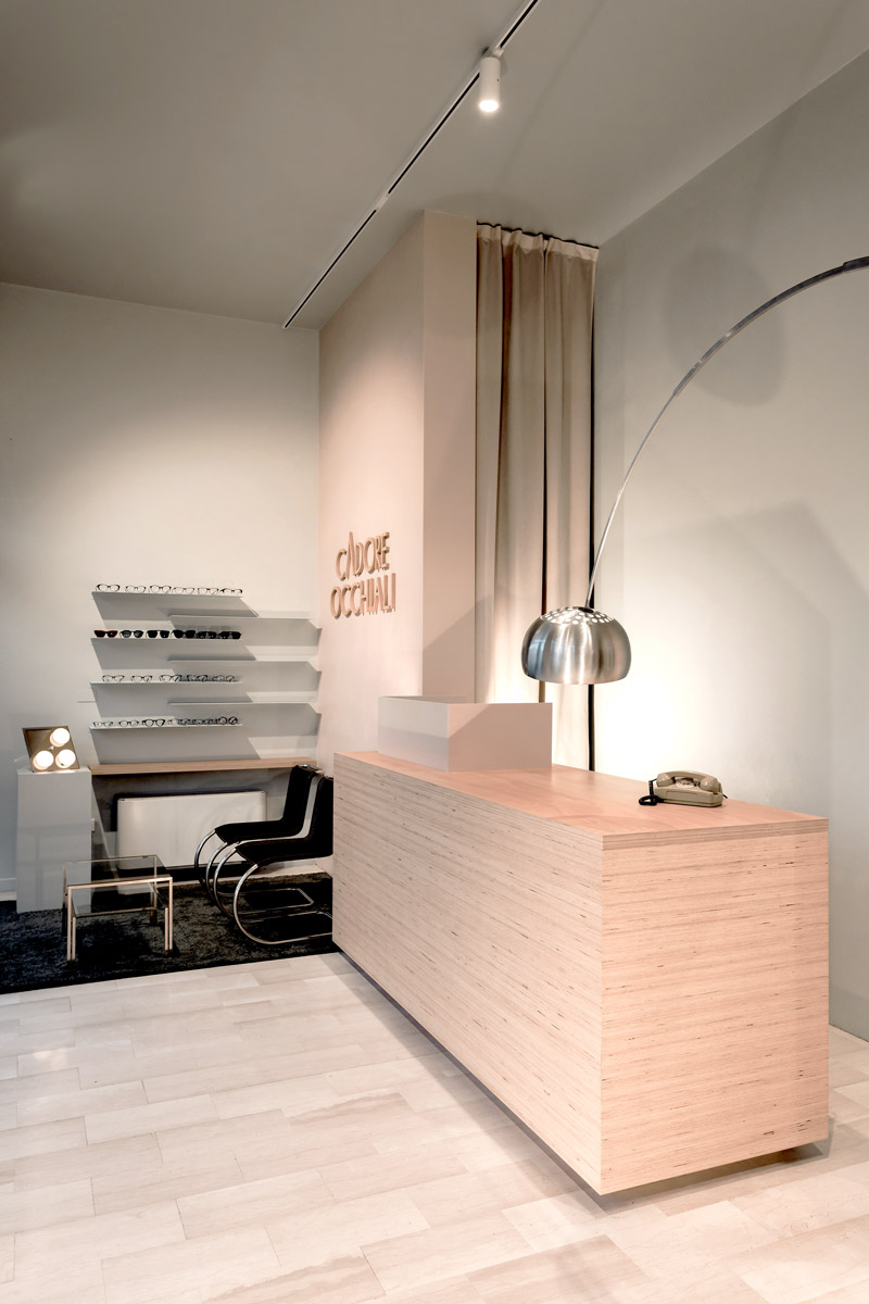 Wooden counter with a chandelier and an old telephone