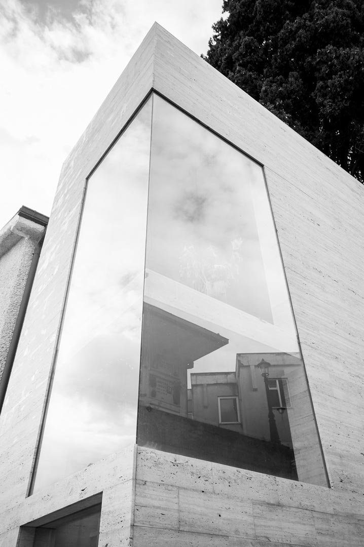 glimpse of the glass facades of the two funeral niches