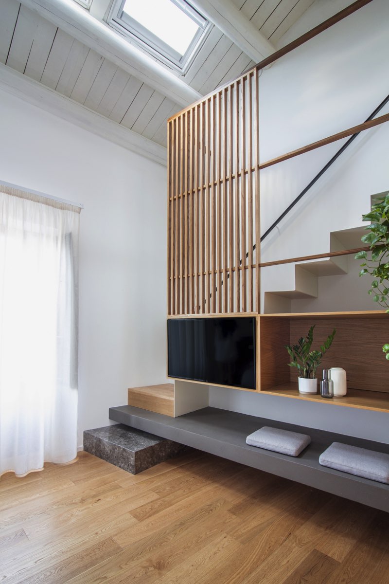 Stone wooden staircase with embedded TV cabinet