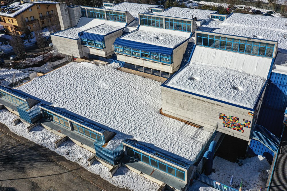 Snow-covered roof of a school